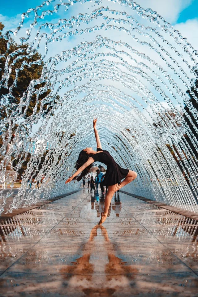 confident person dancing in the water